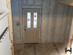 construction process of a residential front door in Wasilla