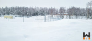 commercial chain link fence with barded wire done by a top construction company in Alaska