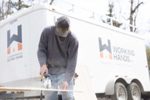 Working Hands crew at work at a dog grooming facility turned home in Alaska