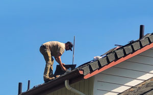 Roof Shingles Repair by Working Hands