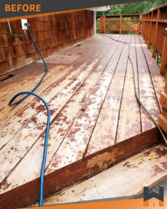 The before photo of a house deck in Alaska before being renovated by Working Hands, LLC