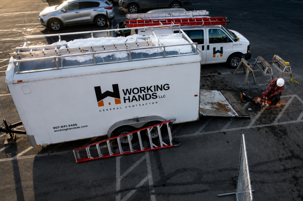 Working Hands LLC crew and equipment at commercial demolition project in Wasilla, Alaska