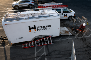 Working Hands LLC crew and equipment at commercial demolition project in Wasilla, Alaska