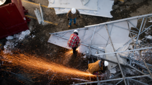 Working Hands crew cutting metal during commercial demolition in Wasilla, Alaska